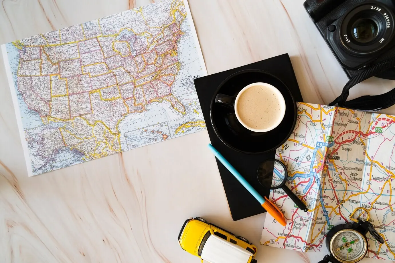 Maps on a wooden background